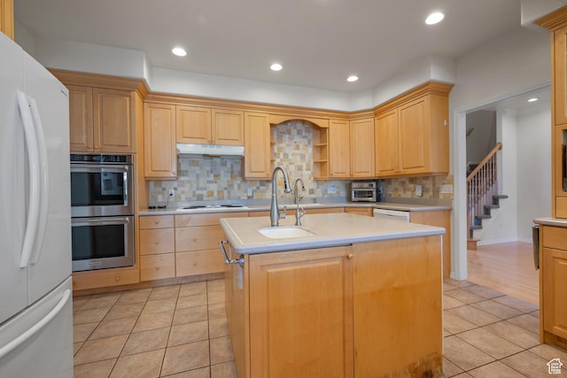 11508 S 5825 W, Payson, UT 84651 - kitchen featuring white appliances, light countertops, tasteful backsplash, light tile patterned floors, and a center island with sink