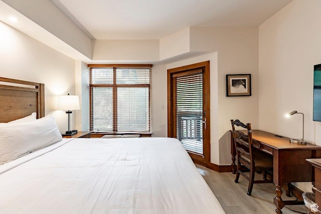 3720 N Sundial Ct Unit B322, Park City, UT 84098 - bedroom with light wood-style floors, access to outside, and an office area