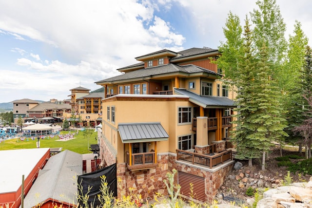 3720 N Sundial Ct Unit B322, Park City, UT 84098 - back of house featuring stucco siding, stone siding, a metal roof, and a standing seam roof