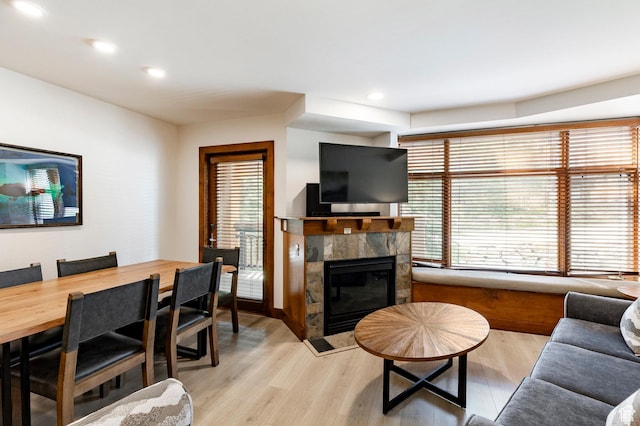 3720 N Sundial Ct Unit B322, Park City, UT 84098 - living room with healthy amount of natural light, light wood finished floors, a tiled fireplace, and recessed lighting