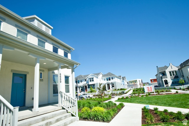 6669 W Skip Rock Rd, South Jordan, UT 84009 - doorway to property featuring a residential view and covered porch