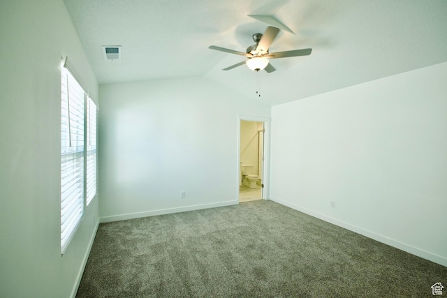 6669 W Skip Rock Rd, South Jordan, UT 84009 - unfurnished bedroom with multiple windows, carpet, vaulted ceiling, ceiling fan, and ensuite bath