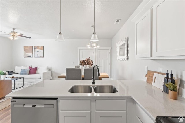 1806 W Newcastle Ln Unit 203, Saratoga Springs, UT 84045 - kitchen featuring dishwasher, a peninsula, white cabinets, a textured ceiling, and ceiling fan