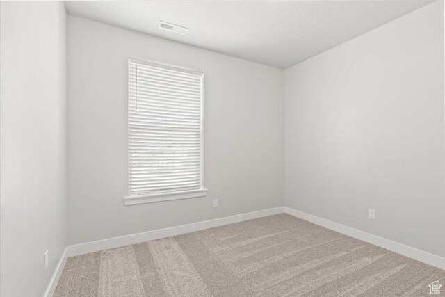 1806 W Newcastle Ln Unit 203, Saratoga Springs, UT 84045 - carpeted spare room with baseboards
