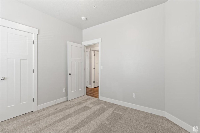 1806 W Newcastle Ln Unit 203, Saratoga Springs, UT 84045 - unfurnished bedroom with carpet and baseboards