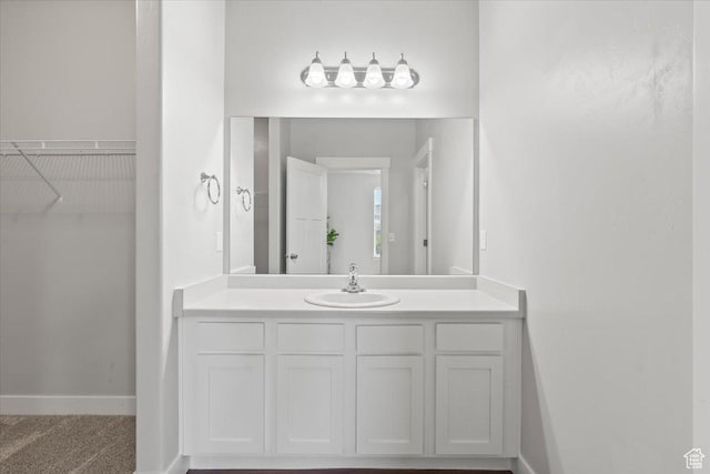 1806 W Newcastle Ln Unit 203, Saratoga Springs, UT 84045 - bathroom with vanity and a walk in closet