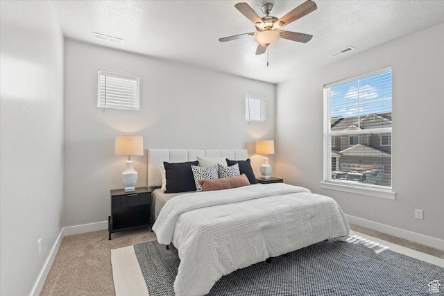 1806 W Newcastle Ln Unit 203, Saratoga Springs, UT 84045 - bedroom featuring a textured ceiling, light colored carpet, and ceiling fan
