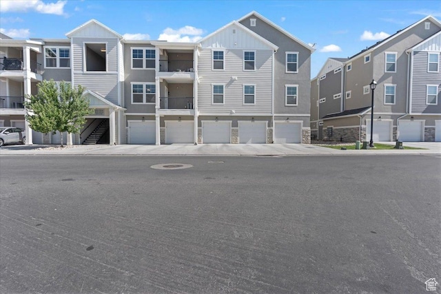 1806 W Newcastle Ln Unit 203, Saratoga Springs, UT 84045 - view of property featuring an attached garage