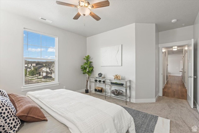 1806 W Newcastle Ln Unit 203, Saratoga Springs, UT 84045 - carpeted bedroom featuring a textured ceiling and ceiling fan