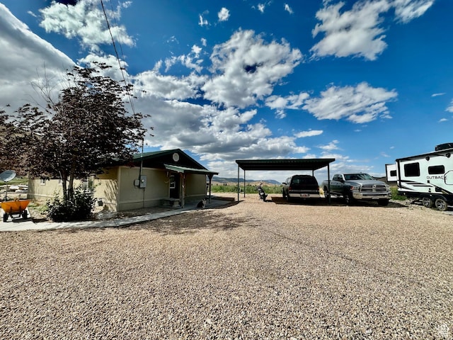 280 W Center St, Sterling, UT 84665 - view of side of home with a detached carport and gravel driveway