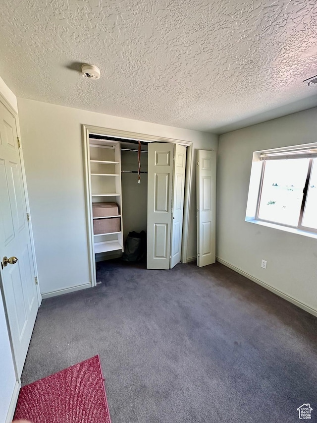280 W Center St, Sterling, UT 84665 - unfurnished bedroom with a textured ceiling, carpet floors, and a closet