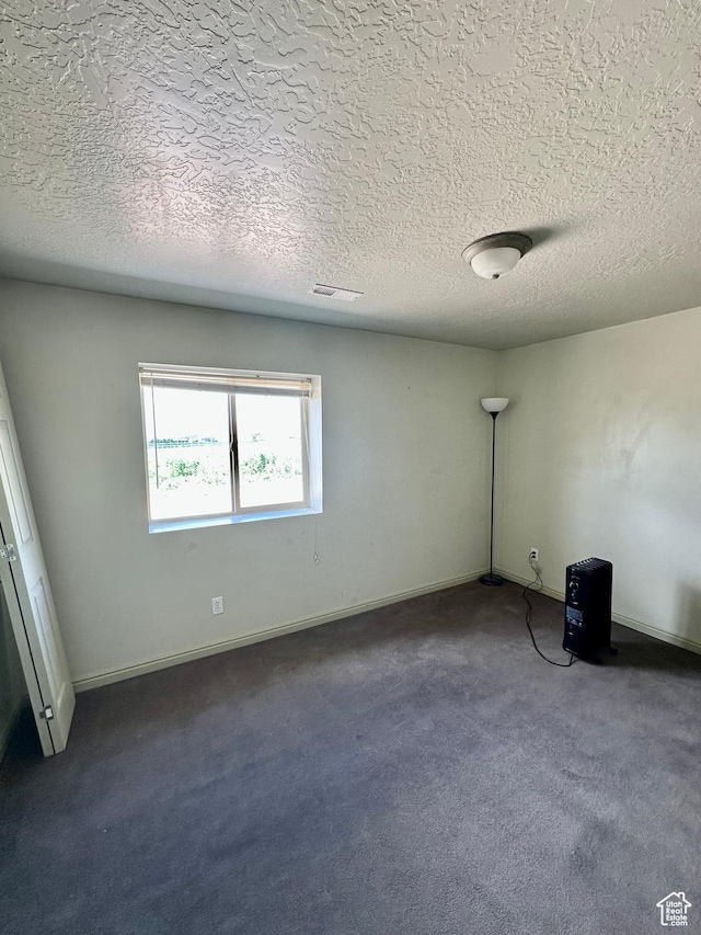 280 W Center St, Sterling, UT 84665 - unfurnished room featuring dark carpet and a textured ceiling