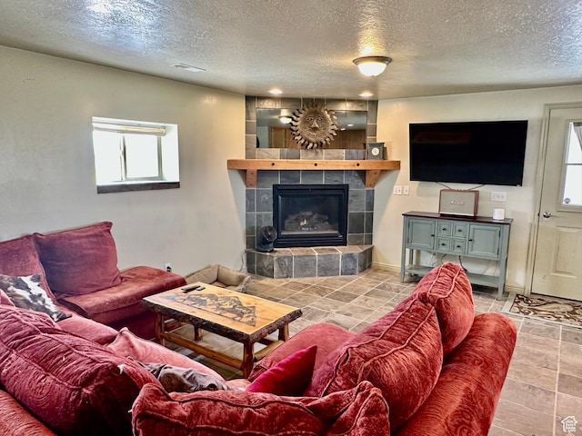280 W Center St, Sterling, UT 84665 - living room featuring a textured ceiling and a tile fireplace