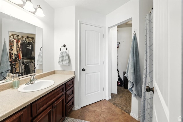487 W 1490 N Unit 106, Logan, UT 84341 - full bath featuring vanity, tile patterned flooring, and a walk in closet