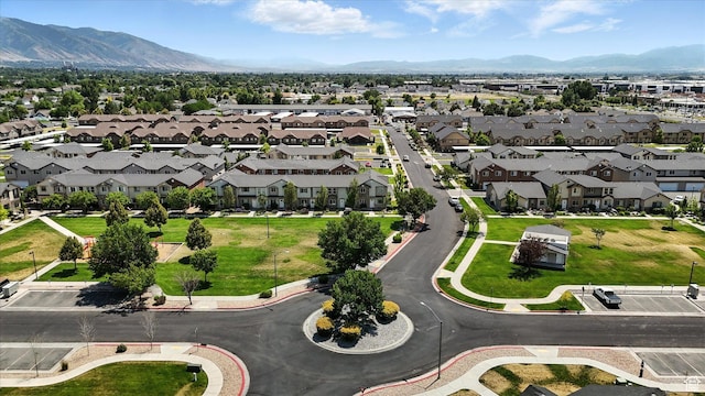 487 W 1490 N Unit 106, Logan, UT 84341 - aerial view of property and surrounding area featuring a mountainous background and nearby suburban area