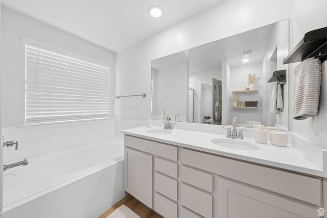 4913 W Olympic View Dr S, Kearns, UT 84118 - bathroom with double vanity and a bath