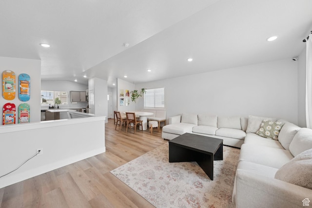4913 W Olympic View Dr S, Kearns, UT 84118 - living room featuring healthy amount of natural light, light wood-style flooring, recessed lighting, and lofted ceiling
