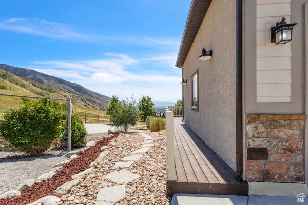 2330 E Meadow Lark Ln, North Logan, UT 84341 - view of property exterior with a mountain view and stucco siding
