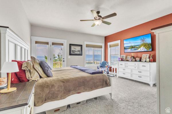2330 E Meadow Lark Ln, North Logan, UT 84341 - carpeted bedroom with access to exterior and a ceiling fan