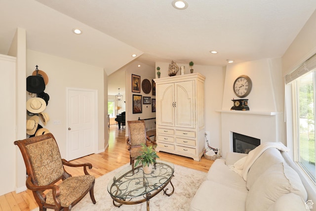 926 N 150 W, American Fork, UT 84003 - living room with light wood-type flooring, a large fireplace, recessed lighting, and lofted ceiling