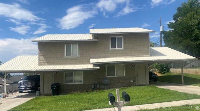 526 W 200 S, Brigham City, UT 84302 - farmhouse inspired home with a carport, driveway, stone siding, and a metal roof