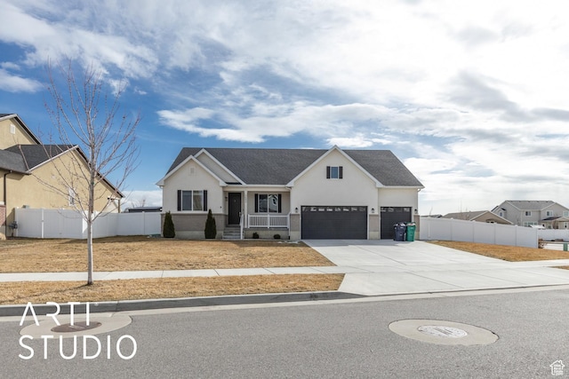 3643 W 650 N, Layton, UT 84041 - view of front facade with stucco siding, driveway, a garage, a shingled roof, and covered porch
