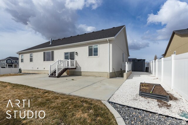 3643 W 650 N, Layton, UT 84041 - rear view of property with stucco siding and a patio area