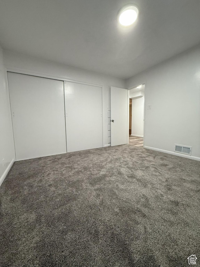 318 E 100 N, Brigham City, UT 84302 - unfurnished bedroom featuring carpet and a closet