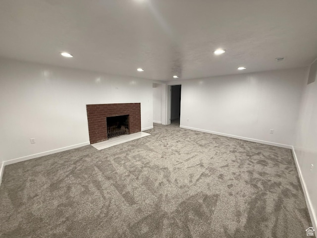 318 E 100 N, Brigham City, UT 84302 - unfurnished living room featuring recessed lighting, carpet flooring, and a brick fireplace