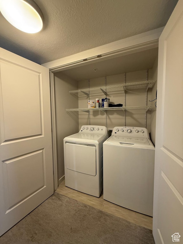 1055 W 1033 N Unit 301, Orem, UT 84057 - laundry room featuring independent washer and dryer and light wood-style floors