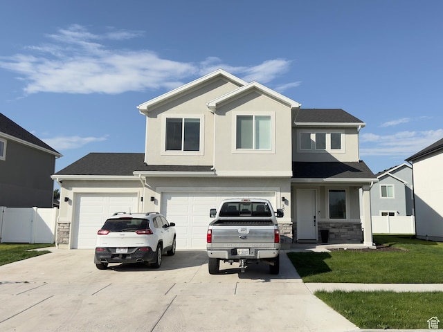 374 W Ropelato Dr S, Nibley, UT 84321 - traditional-style home with driveway, stone siding, and stucco siding