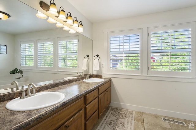 10907 Tahoe Way S, Jordan, UT 84009 - bathroom with double vanity, tile patterned flooring, and a tub to relax in
