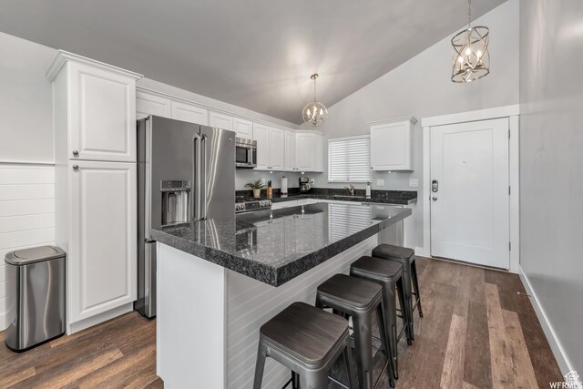 247 S 700 E Unit 54, Salt Lake City, UT 84102 - kitchen featuring appliances with stainless steel finishes, a chandelier, white cabinetry, dark wood-style floors, and high vaulted ceiling