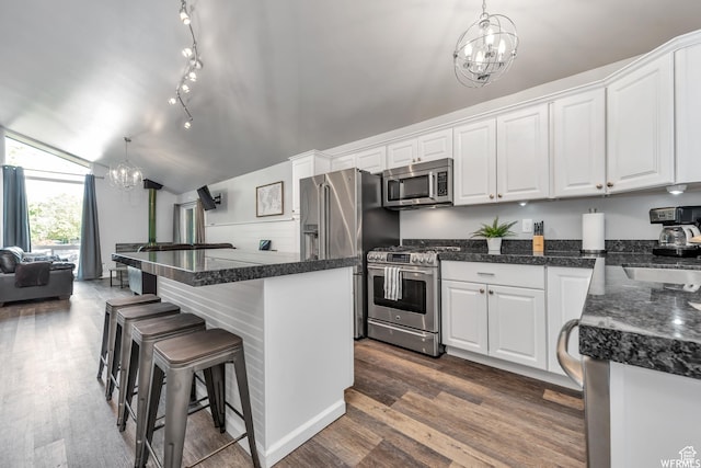247 S 700 E Unit 54, Salt Lake City, UT 84102 - kitchen featuring a chandelier, appliances with stainless steel finishes, white cabinetry, dark wood-style floors, and a kitchen bar