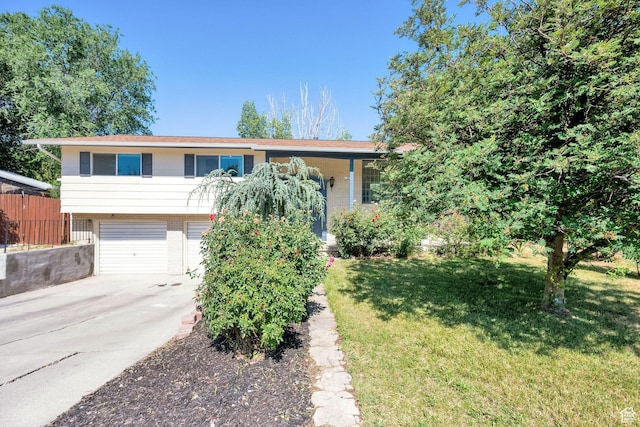 1888 W 7265 S, West Jordan, UT 84084 - view of front of house featuring an attached garage, brick siding, and concrete driveway