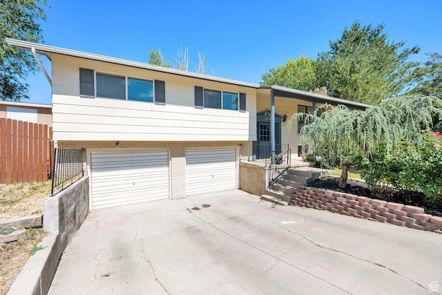 1888 W 7265 S, West Jordan, UT 84084 - raised ranch with a garage, concrete driveway, and brick siding