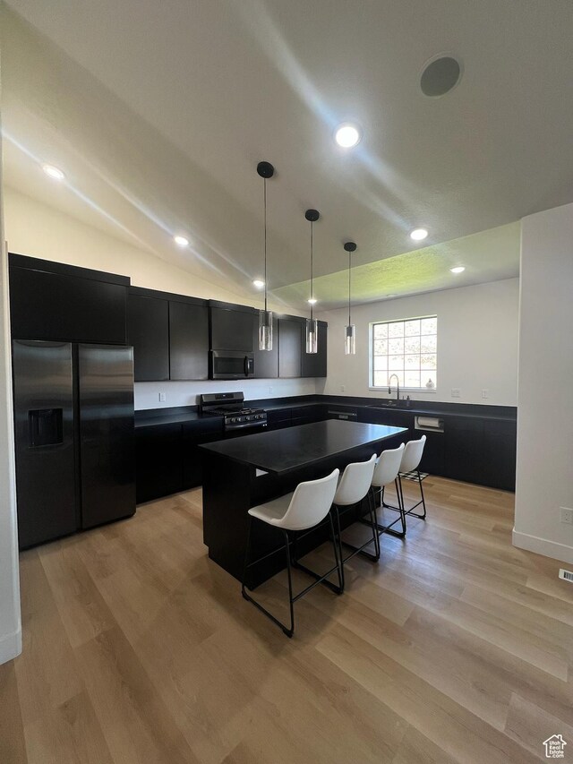 420 W 350 N, Gunnison, UT 84634 - kitchen featuring dark cabinets, stainless steel appliances, dark countertops, light wood finished floors, and recessed lighting