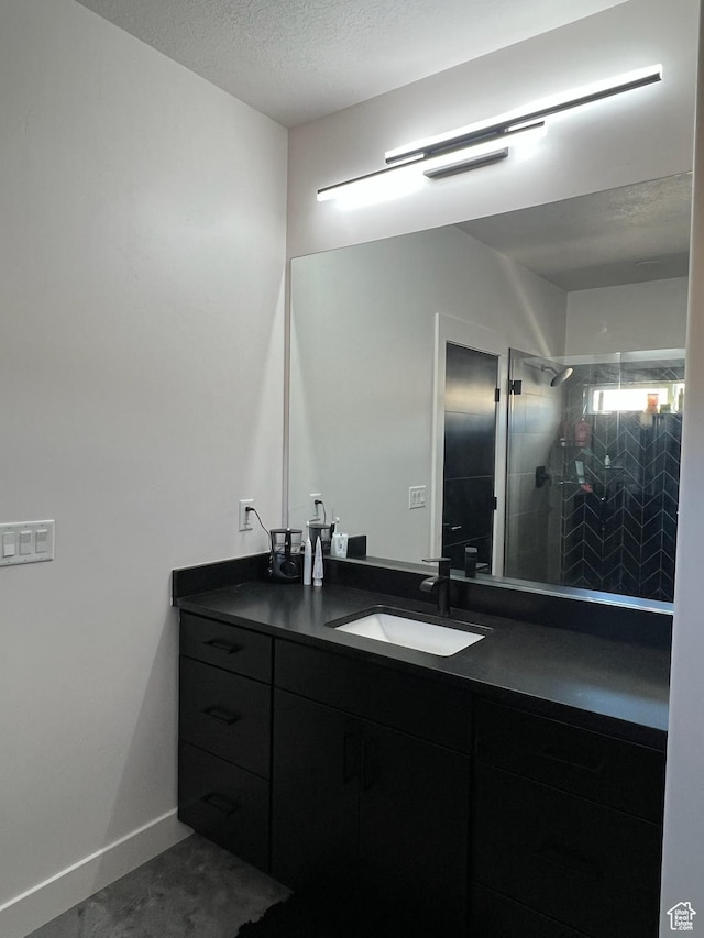 420 W 350 N, Gunnison, UT 84634 - bathroom featuring vanity, a shower stall, and a textured ceiling