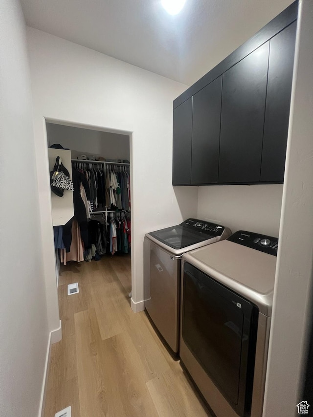 420 W 350 N, Gunnison, UT 84634 - washroom featuring separate washer and dryer, light wood-style floors, and cabinet space