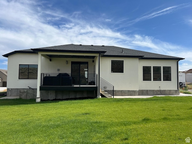 420 W 350 N, Gunnison, UT 84634 - rear view of house with a lawn, stucco siding, and a shingled roof