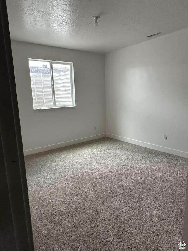 420 W 350 N, Gunnison, UT 84634 - carpeted empty room with baseboards and a textured ceiling