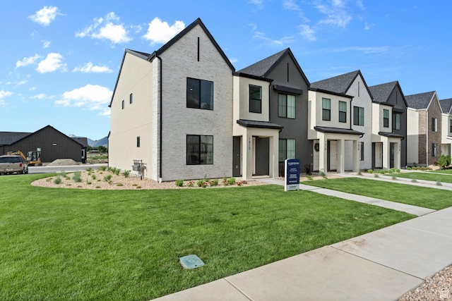1529 E 720 N Unit 1065, Salem, UT 84653 - view of front of property with a residential view, a front lawn, and brick siding