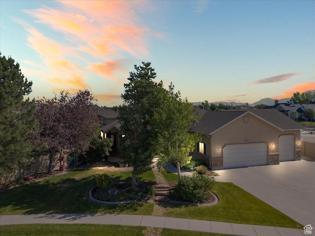 2602 W 11625 S, Riverton, UT 84095 - view of front of house with a garage, concrete driveway, a front yard, and stucco siding