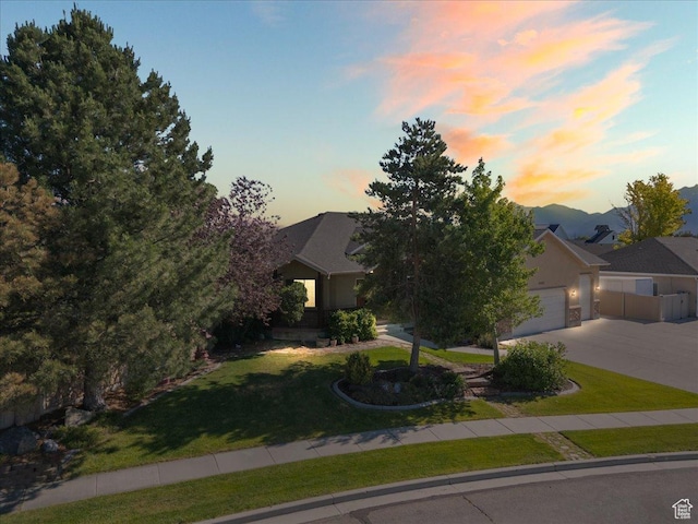 2602 W 11625 S, Riverton, UT 84095 - view of property hidden behind natural elements featuring a front lawn, driveway, and an attached garage