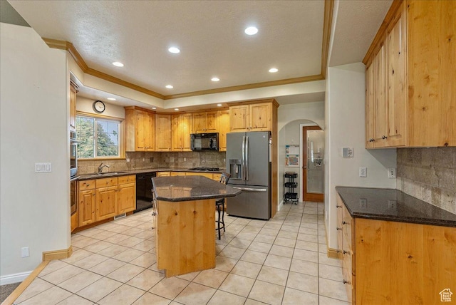 2602 W 11625 S, Riverton, UT 84095 - kitchen featuring black appliances, arched walkways, tasteful backsplash, a breakfast bar area, and recessed lighting
