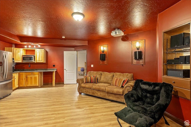 2602 W 11625 S, Riverton, UT 84095 - living area with light wood-style floors and a textured ceiling