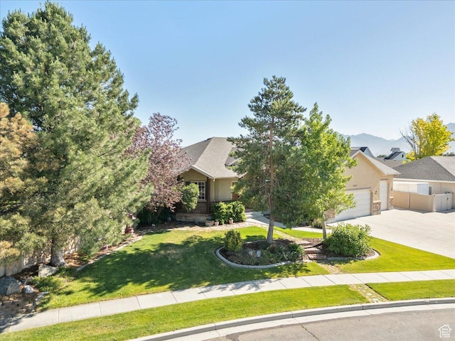 2602 W 11625 S, Riverton, UT 84095 - view of property hidden behind natural elements with concrete driveway and an attached garage
