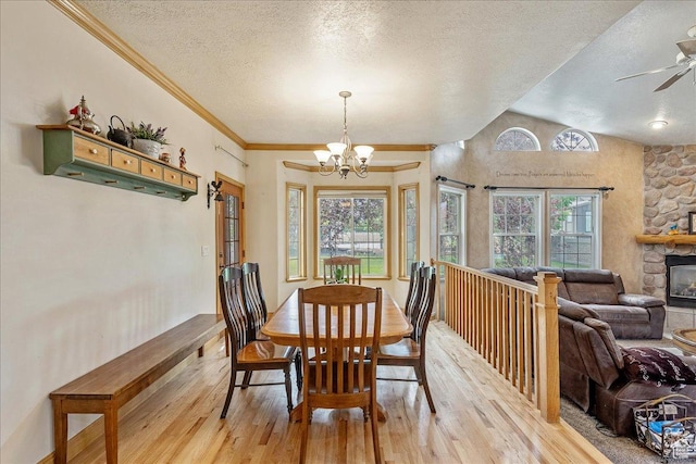 2602 W 11625 S, Riverton, UT 84095 - dining area featuring light wood-style flooring, healthy amount of natural light, a chandelier, a textured ceiling, and a ceiling fan
