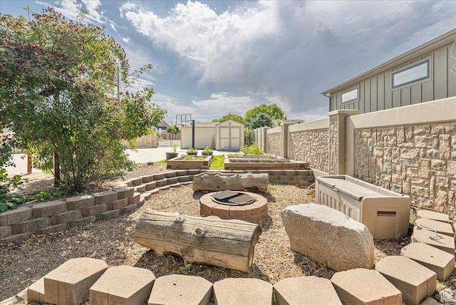 2602 W 11625 S, Riverton, UT 84095 - view of patio / terrace featuring a garden and a shed