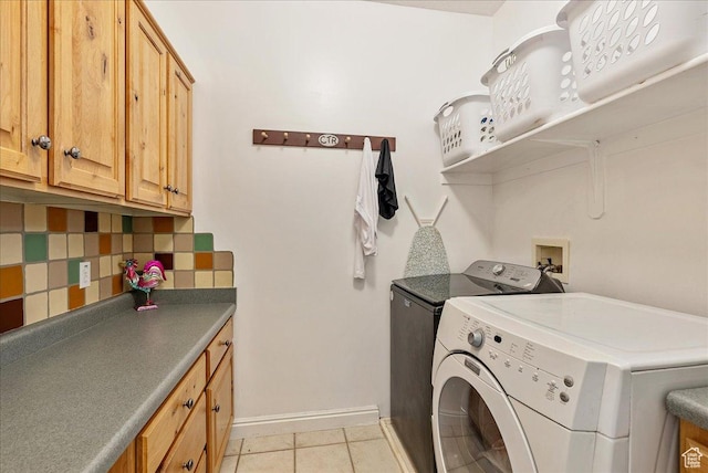 2602 W 11625 S, Riverton, UT 84095 - laundry area featuring washer and clothes dryer, light tile patterned floors, and cabinet space